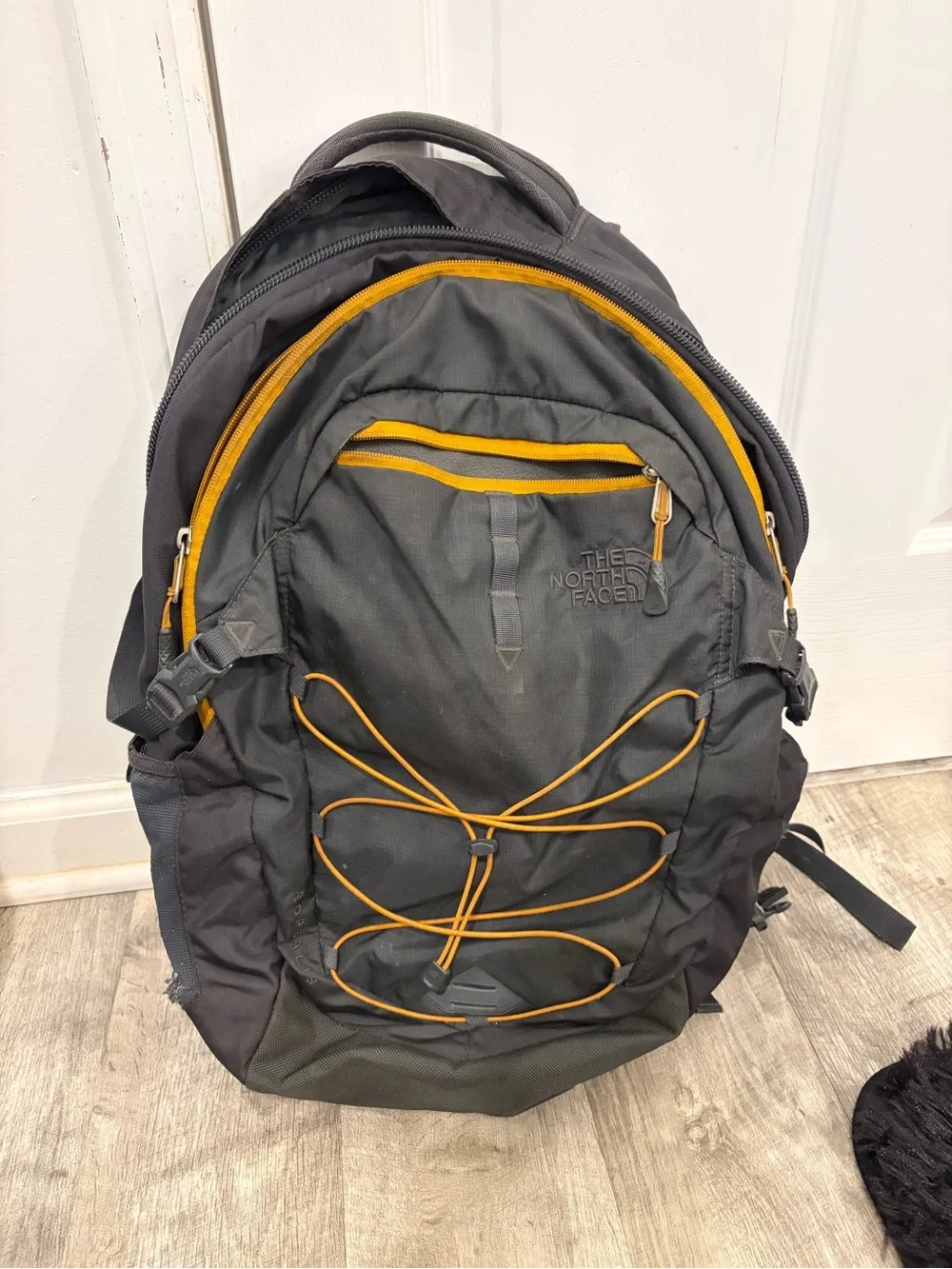 The North Face Gray Backpack with Yellow Trim